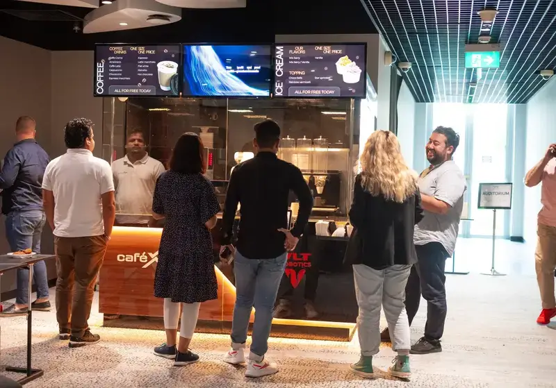 xbot robotic cafe srounded with people